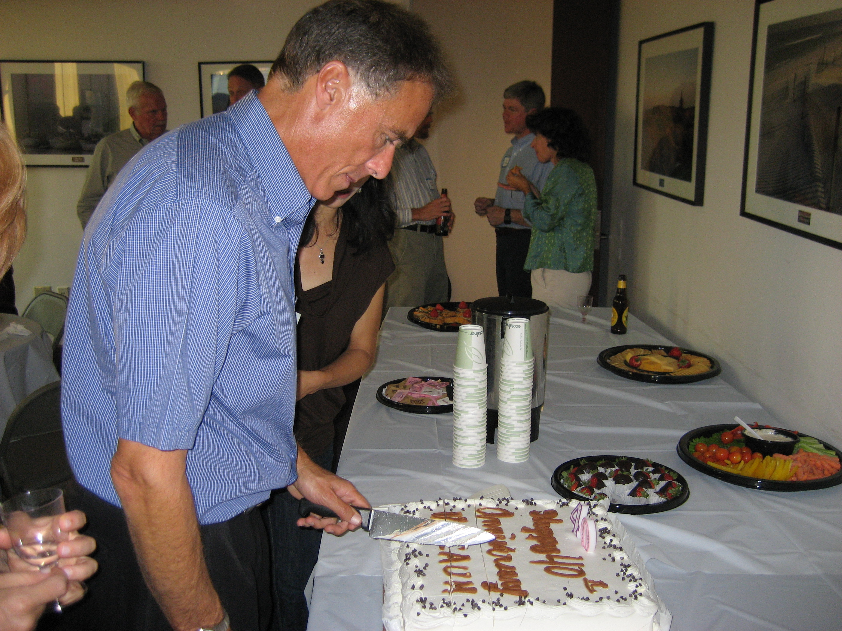 Arthur cutting the anniversary cake