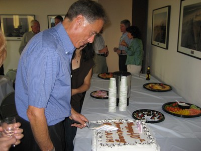 Arthur cutting the anniversary cake